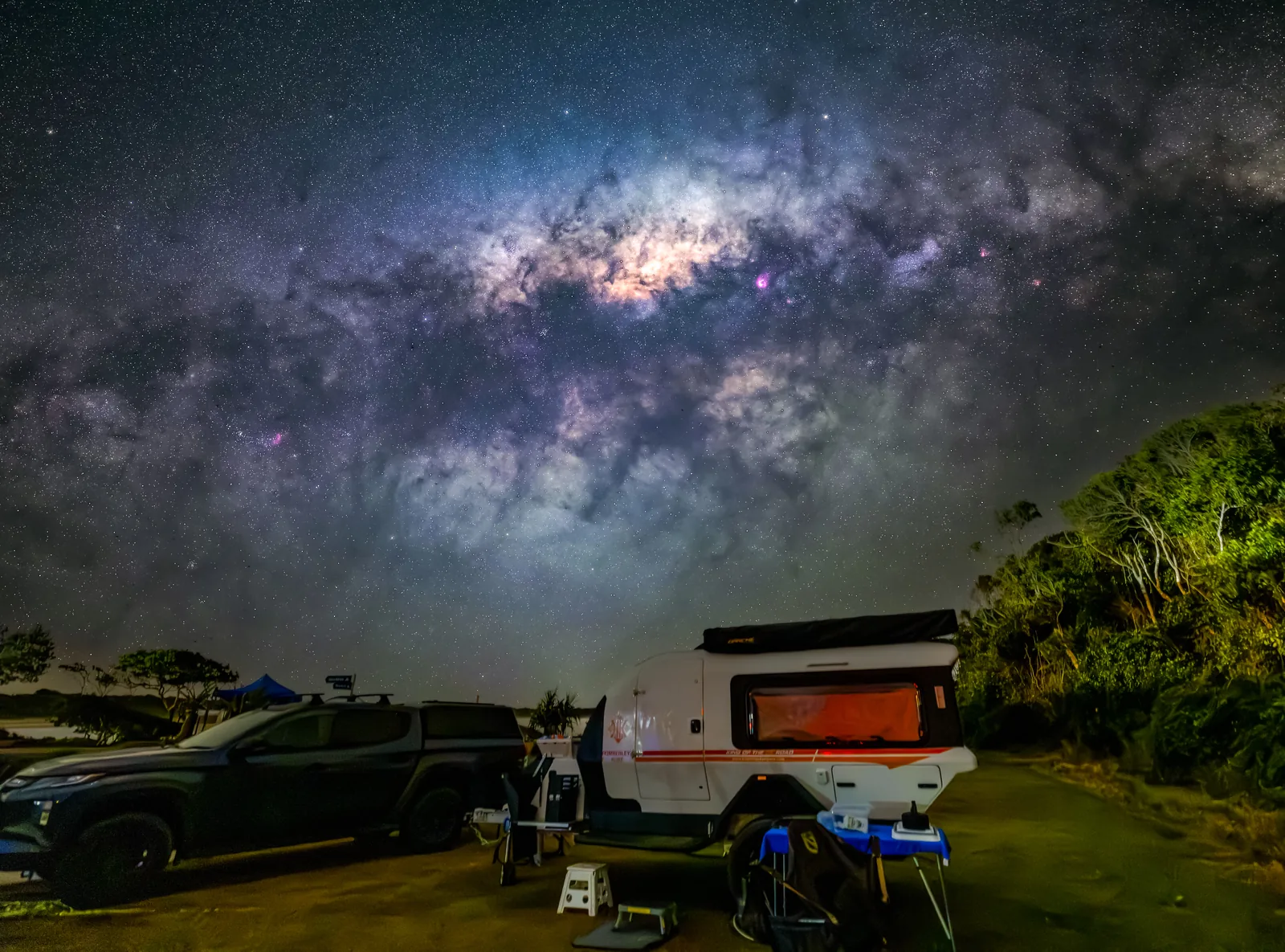 The Kimberley Kube set up creekside, king bed lit and kitchen out, ready for a night well off the beaten track.